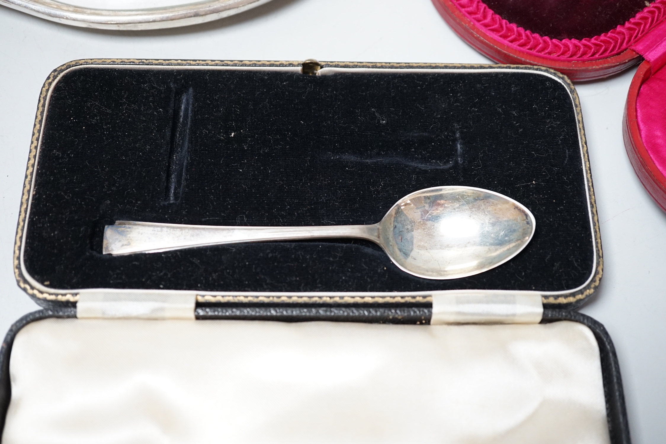 A George IV silver meat skewer, Robert Poulden, London, 1821, 30cm and other sundry silver including a George V bowl, a cased christening trio, pair of dwarf candlesticks, cased butter dish and knife, hand mirror etc.